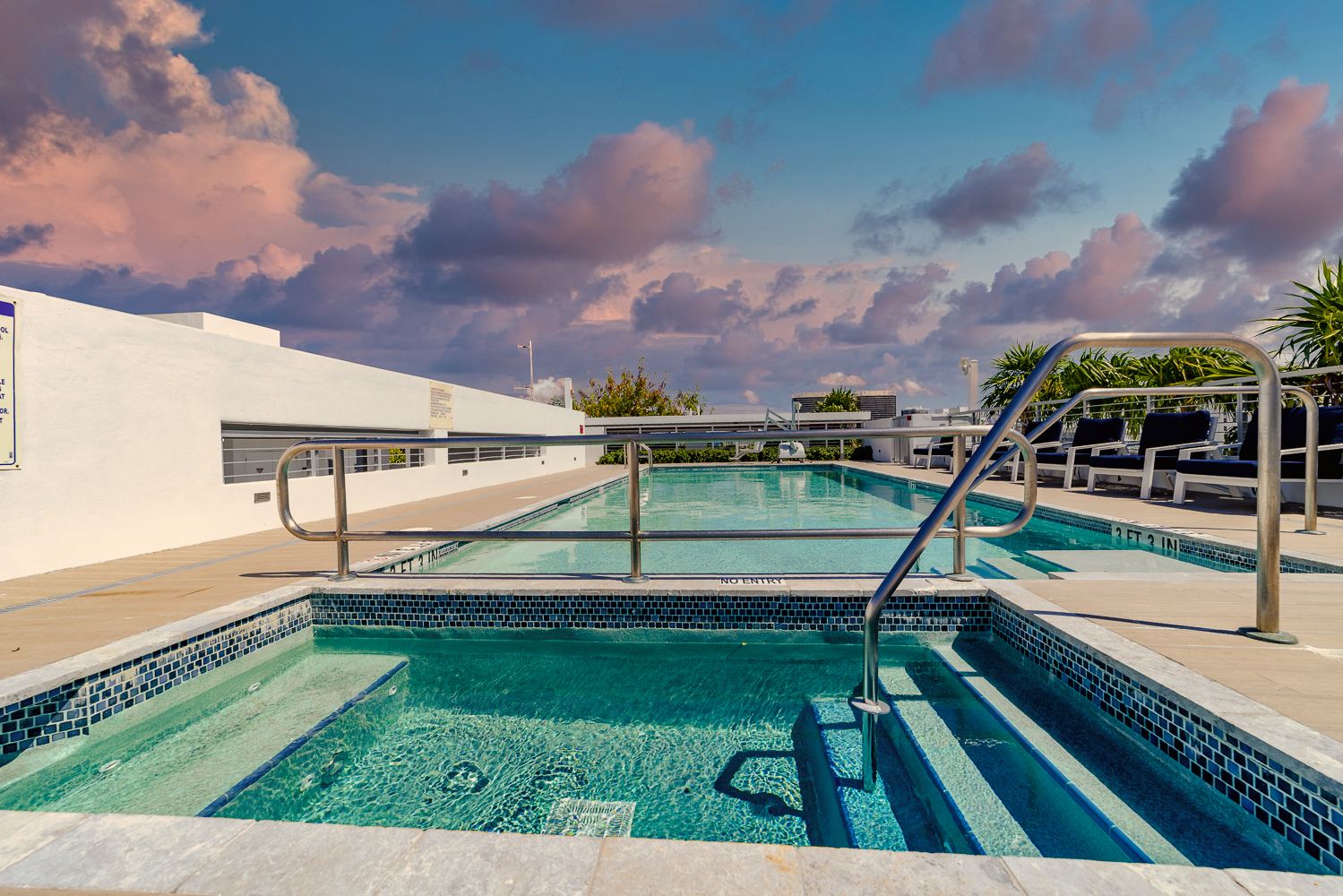 Rooftop pool at twilight overlooking Biscayne Bay